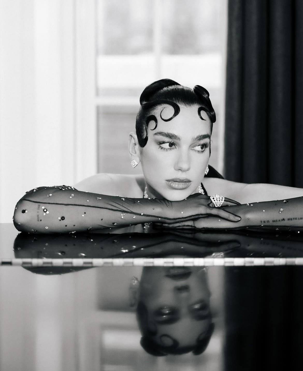 Dua Lipa Channels Old Hollywood in Custom Chanel at the 2025 Met Gala